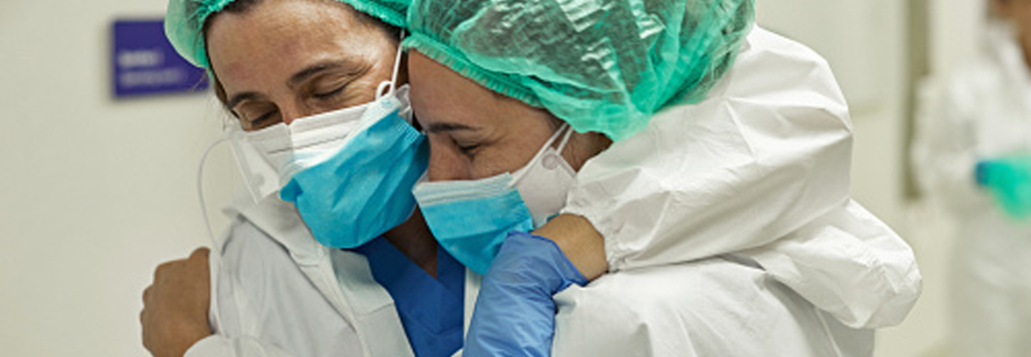 Two Boston Children's Hospital doctors hugging and celebrating success.
