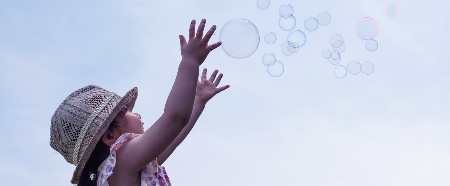 growing-bubbles_1210-min Image of a girl catching bubbles in the air.